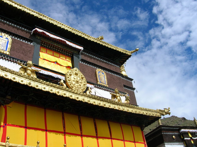 Eight spoked wheel of dharma symbolizes the 8-fold path of Buddhism. Lhasa, Tibet.